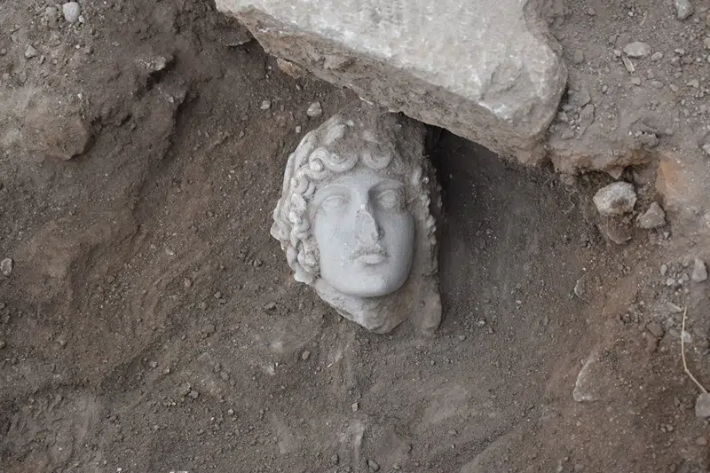 Archaeology students in Greece unearth statue head of god Apollo