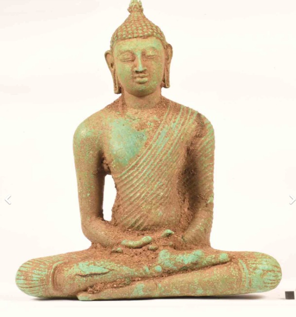 Sitting Buddha statue incidentally found in a paddy field