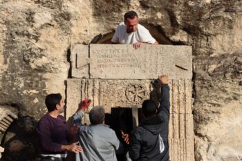 A tabula ansata featuring a bilingual inscription, found in front of a burial chamber adorned with the monogram of Jesus Christ, was restored